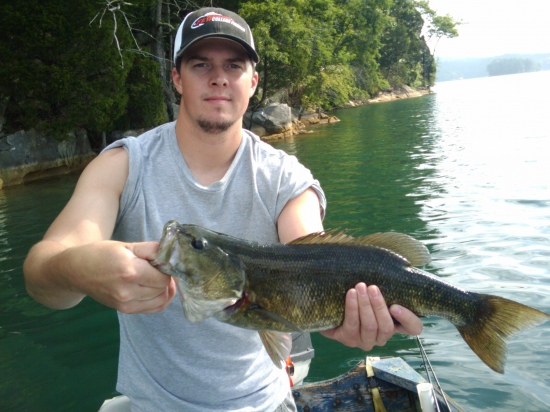4lb Norris Lake (Tennessee) smallmouth caught on a Spot Remover shakey head with a zoom green pumpkin finesse worm fished at about 30 ft off a steep rock shelf near Hickory Star Marina... He fought like a 