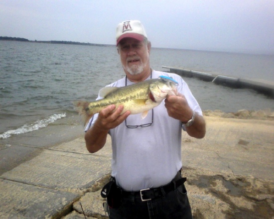 Caught on Grapevine Lake (TX) using a floating minnow along the edge of a boatramp. The biggest of six fish in about two hours of fishing. This one weighed in at just over 2 lbs.