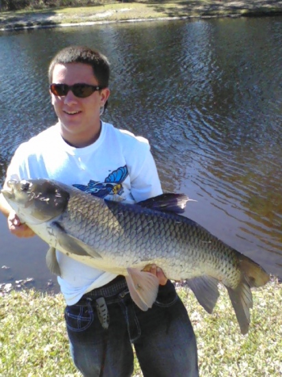 My brother caught this 50inch grass carp out of a local lake.We saw many more this size that were waking on the surface but this was the only one we could get to eat