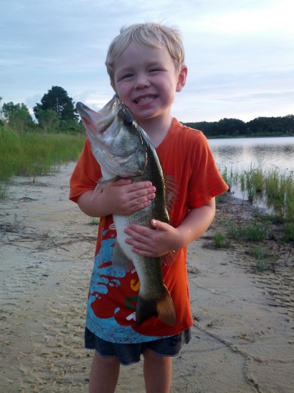 This is Colton and he is two and a half. He already loves to fish and He helped his daddy reel in this 7lb large mouth on a lake behind thier house