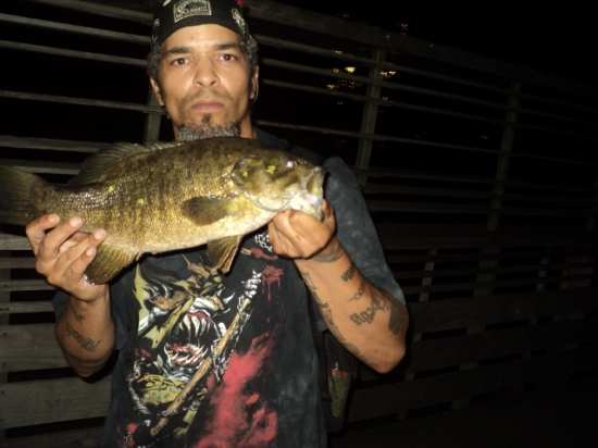 fishing in NEW YORK CITY IS GREAT,,,CENTRAL PARK'S TURTLE POND AT NIGHT TWITCHING MY MR.TWISTER WORM ON TOP OF THE DUCKWEEDS,,,,4LBS ....JC...