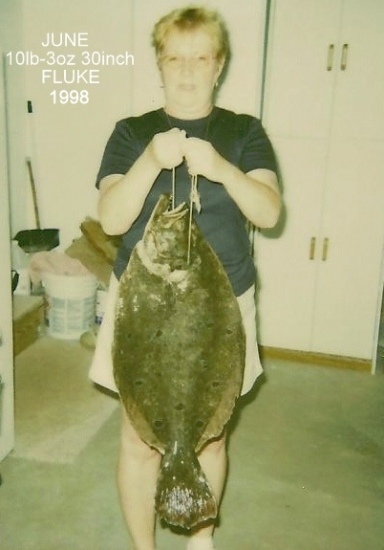This is my wife June. She caught this 10lb 3oz-30inch Fluke off of Holgate on LBI, NJ. The only fish she ever caught. Her theory is this, I can't get one bigger so why try?? she doesn't like boats. Oh Well,  Good Fishing  Fran