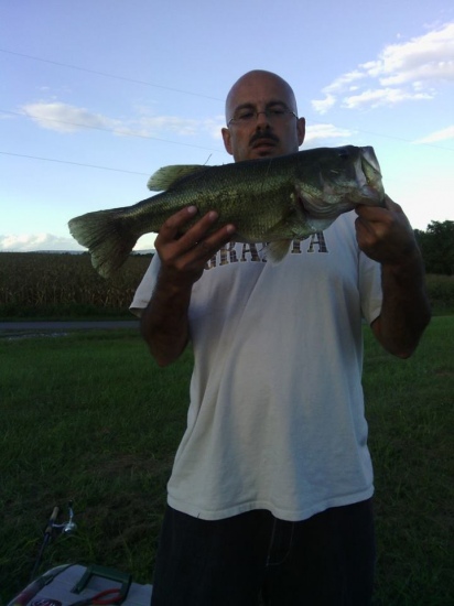 22 in bass caught on Tequila Sunrise plastic worm at local pond