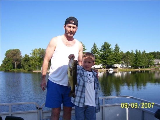 Mike Foreman with my nephew Seth Scott Foreman on lake James in Prudenville, MI  I taught my nephew to fish when he was 2 years of age, this nice Largemouth he caught in September of 09 he was 9 years of age