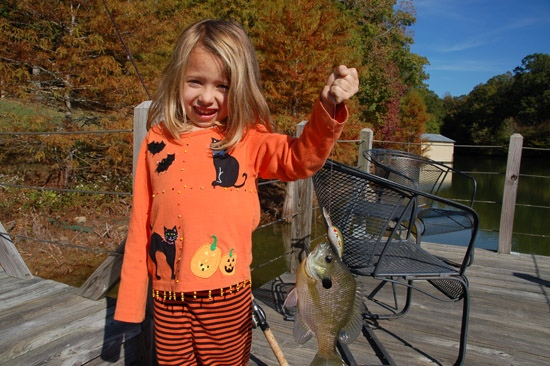 She does not know what is scarier - her Halloween shirt or the giant Bluegill that tried to eat a Bill Dance Fat Free Shad crank bait!