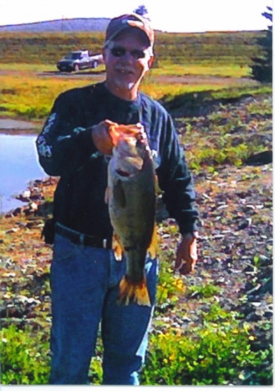 I caught this bass in a local pond in June of '07. Estimated weight of about 7 lbs. I was using a Quantum rod and reel,(spinning), and 30 test power pro line. Lure, 5 in. yum dinger, junebug color and 3/0 ewg matzuo hook, t-rigged. She was caught in about 2 ft. deep water, around 7 a.m.