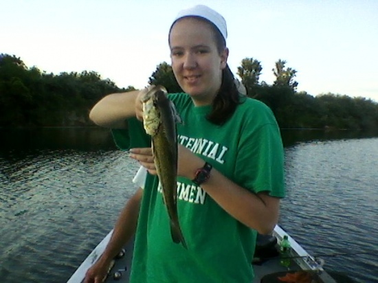 My 16 yr. old daughter Meghan caught this 2lb. 4oz. bass on a 4ft micro-light rod and reel with 6lb test and a crappie jig! All I could think of as the pole bent like a u was please do not break Mark's pole! And expecting one of her large crappie up comes Mr. Bass!!!! Caught at Snake Den Hollow, Victoria, IL.