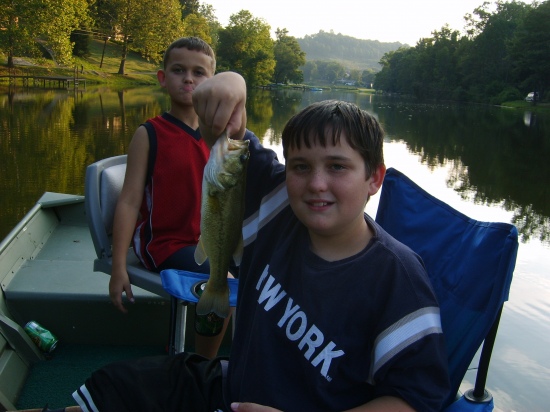 I THOUGHT THIS PICTURE WAS FUNNY! MY YOUNGEST SON WAS A LITTLE JEALOUS OF THE FISH MY OLDEST SON CAUGHT. HE CAUGHT IT IN A PRIVATE LAKE IN W.V. WASN'T VERY BIG BUT WE HAD FUN.