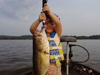 Dani Reeves,3year old,with a 5 lb bass caught in late August on deep structure with carolina rig in Chattanooga, TN.