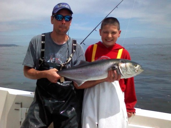 My son Miguel's first time out on the ocean. Couldn't get him on the Stripers but he had a blast landing this Blue fish and four others. That's my friend Jim who was able to put Miguel on the fish.