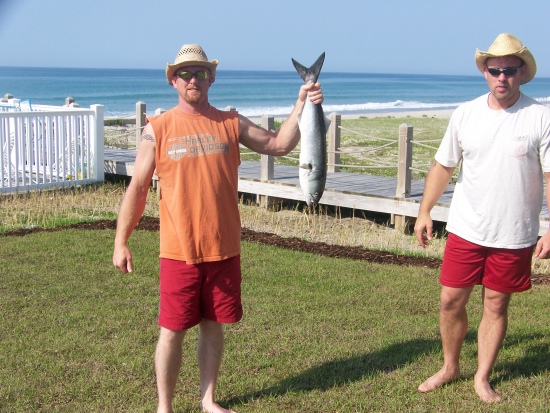 Johnny Perkins and Joseph Perkins work together to pull in this giant bluefish