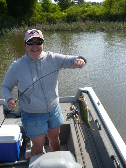 My wife Teressa's 2nd Bass ever. Caught at Wheeler lake AL. 23 April 2010. You can't buy a smile like that, you have to go out and catch it. Thanks Mr. dance