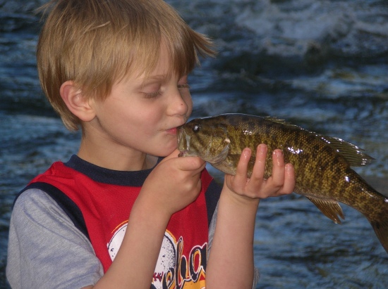 You can tell who my son's favorite TV fisherman is!!  He wanted to get a picture letting this smallmouth he caught in the North Georgia Mountains like Bill does.