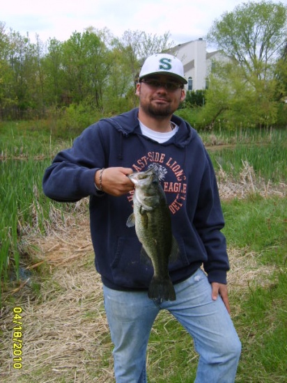 This is my son Johnny. We were fishing with shiners in a farm pond in Md. near Baltimore when this 3lb. 1 oz. largemouth hit.