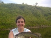 I am proudly submitting this picture of a bass my 18 year olf daughter, Morgan Anderson, caught on Memorial Day weekend 2012.  This came from our strip pits located near Clinton Missouri.  She caught it on a green grass frog.  It weighed 7 lbs 4 ounces.  The bass was released after the photo