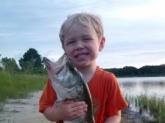 This is Colton and he is two and a half. He already loves to fish and He helped his daddy reel in this 7lb large mouth on a lake behind thier house