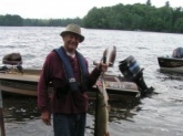 June 2012 on Little Spider Lake in Wisconsin.  43 Inches and 22 Lbs.  Only out of the water for picture.  Released.  Caught on a Lindy Musky Killer, fish scale blade and black bucktail.