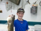 Caught by Carsen  in Janesville, Wi. on the Rock River. 19 1/2 inch Walleye.  Carsen is one of your biggest Fans!
