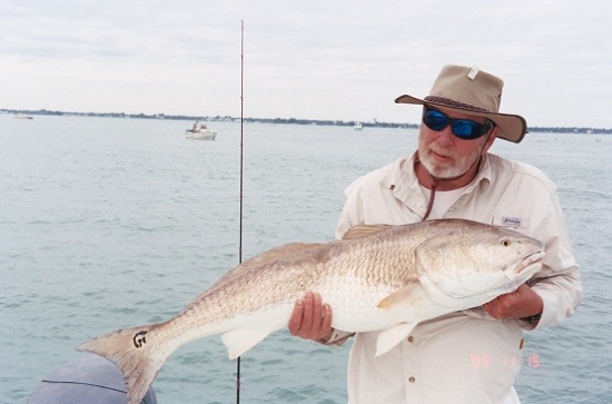 We were floating Sebastian Inlet in FL with live pinfish and Sam hooked into this 42 inch Red fish and it took 20 minutes to land it on 14 lb line.  We are guessing the weight at around 40 lbs.  The same day his wife Martha hooked up with a jack that would have went at least 30 lbs. Once we seen what it was we just played it hard and it got off before we landed it.