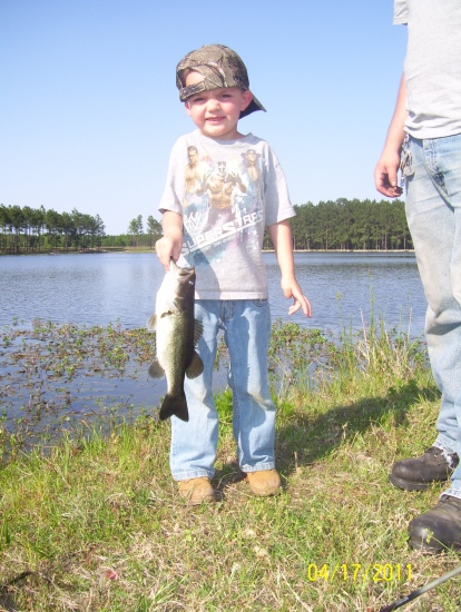I'm Edward Mobley and I'm proud of this piture. This is My 5 year old son Judson with his first bass ever.It was 2.5 pounds but to him it was 20 pounds. He usually fishes for bream but that day he wanted to try to fish with one of my lures,so I let him pick out what he wanted to use.It was a shiner color swim bait by Zoom.