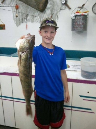 Caught by Carsen  in Janesville, Wi. on the Rock River. 19 1/2 inch Walleye.  Carsen is one of your biggest Fans!