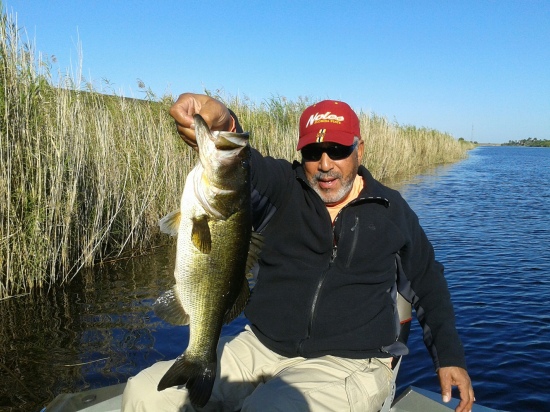 A week at Lake Okeechobee Florida Brother Henry lands the biggest large mouth Bass 10 lbs 4 ounces , what a vacation it was!