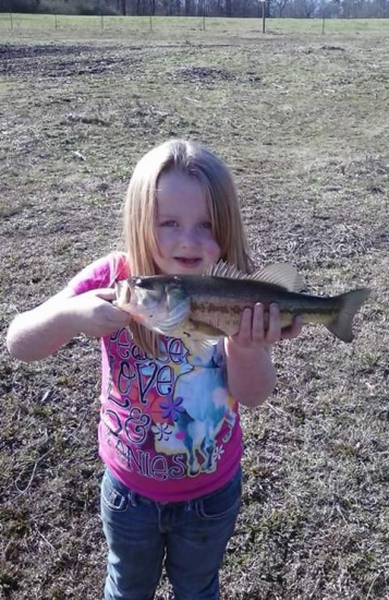 Hi im Laycee and Im 7yrs old and my mommy leah took me fishing at our grandpas pond and I caught this nice 2 pound bass!!!
