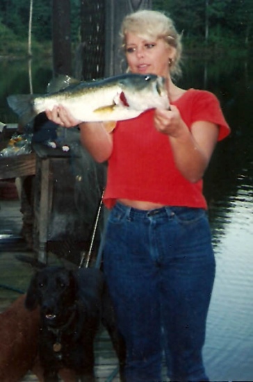 I caught this bass in a private pond just outside of Athens, Georgia. I used a grape weedless worm on a Carolina rig. I released the bass without weighing it, so not sure of the weight.