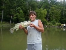 i cought this bass in dalton ga at a pond beyind my house with a mans baby bass it was about for pounds