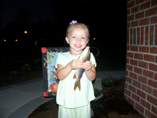 Paige Perkins, 3 years old, reeled in her first carp