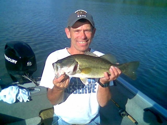 After my son Brandon caught his 3.5 lb, I landed this 4 lbs using a Fluke, April 25, 2010 at Lake Guntersville in Scottsboro, Alabama in the same cove out of the winds that were blowing gusts close to 30 mph.