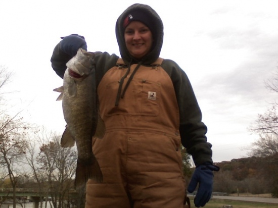 I caught my 5 1/2 lbs, 22 inch smallmouth on a creek off the cumberland river in Ashland City Tn. It was cold and rainy that day, hence the coveralls.I caught it on a 6 inch plastic worm crawfish color. Lookout bassmasters here I come!!!!
