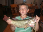 This fish was caught at a private lake in my subdivion in St Charles, MO. This Largemouth Bass was caught by Austin who is 9 years old. It was 22