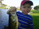 My son Peter (who's met Bill Dance twice) with his second bass ever. 2 pounds 9 oz on a private lake in Kissimmee, Florida