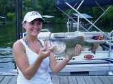 My Stepdaughter, Cassie Heavrin and I were fishing on Lake Barkley this past fall (Sept 2008)while she was taking a much-needed break from school. We were fishing an old roadbed near Eddyville State Prison when she caught this 5lb., 8 oz Largemouth. Initially, I thought she was 