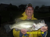 Hi Bill, This my personal best Largemouth. Caught her on May 02, 2010, on a chigger craw and 1/16 oz shakey head jig. In the rain, imagine that. No scale to weigh her or no tape measure to measure her either. All I know is that I am one happy camper. Say Bill, where does a bass go when it misses your offering? Your fan of at least twenty years. Thanks for all you do for our sport. Sincerely, Jim Aleshire-Dayton,Ohio. PS This girl was caught in a storm-water collection pond where I live, been there since 1993.