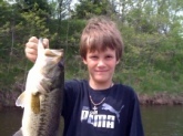My 9-year old son Jeremy with his 1st bass on his 2nd cast with his new baitcaster combo. 4lb. 4oz.  White spinnerbait at strip pits in Missouri.  He now thinks catchin bass like these will happen every 2 casts. I wish he were right!! :)