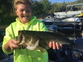 This is my 12year old son    Fishing on baboosic lake in Amherst nh.   He's already caught 14 fish over 6 lbs this year