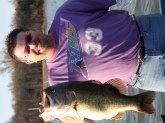 This was caught by me on March 22,2009. I was using a 2-4 foot huge crankbait and it busted it in fairly deep water considering everyone else was saying they were catching them in very shallow water. My son Christian was with me and he grabbed up the net and netted it like a pro. This largemouth weighed 11.3 lbs on my digital scales and it weighed the same when I officially weighed it in at Gibson County Lake by the TWRA. I got me a big one like Bill Dance catches!!!