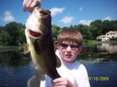 im 12 years old bill i love your show this is a bass i caught in mass. over vacation with my dad it weighed 6 pounds and me and my dad were about to leave and i did one more cast as soon as it hit the water i thought i had weeds and then i saw the line moving so i set the hook my pumpkinseed power worm was all torn up.         thanks bill love your show               nick