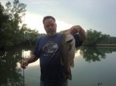 Grandson wanted me to take a pic with the fish, it is the biggest bass come out of this pond in a few years.