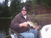 I caught this 1.5lb largemouth on Tenmile Lake in Oregon.  It is my first bass.  I never really bass fished before.  I went a couple of times, a long time ago.  But now i am hooked.  I think bass fishing is the best.  I want to thank Bill Dance for the help his show gives,  he really explains things so it can be understood.