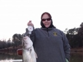 Lake Oliver, Columbus, GA 10 lb striper caught Jan 13, 2010 on a blue/black Booyah Boogie Bait using 10 lb test.  My first catch on my new Quantum IM8 Code combo.  Thanks Bill for showing me how it's done!