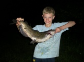12 poud channel catfish  I caught it down at my granpa's farm in Gerald, MO  I used a rapela, 6 pound test, open face at night. I was 10 when I caught it, I am now 12 years old.
