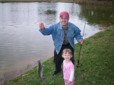 Frankie and 2 yr old daughter Sara with catfish in Pinellas Park, FL - about 1-2 lbs